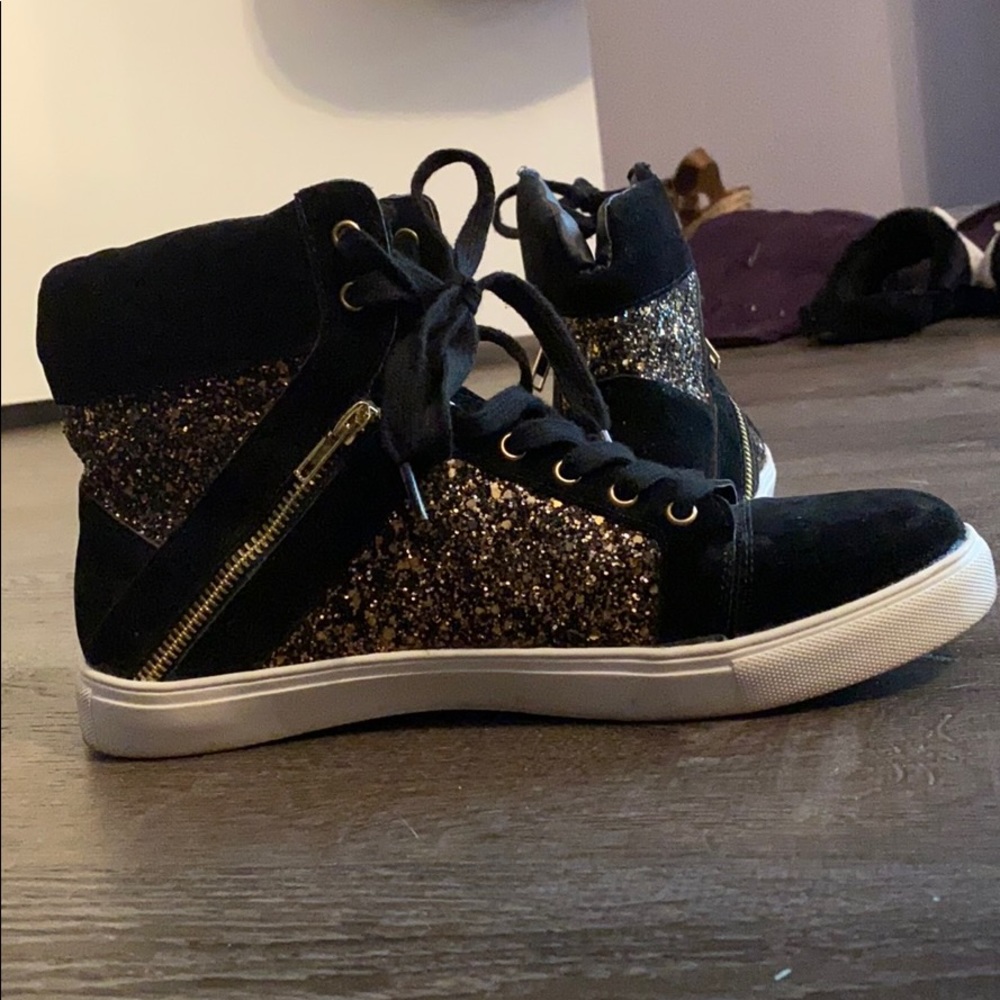 Black and gold high top sneakers